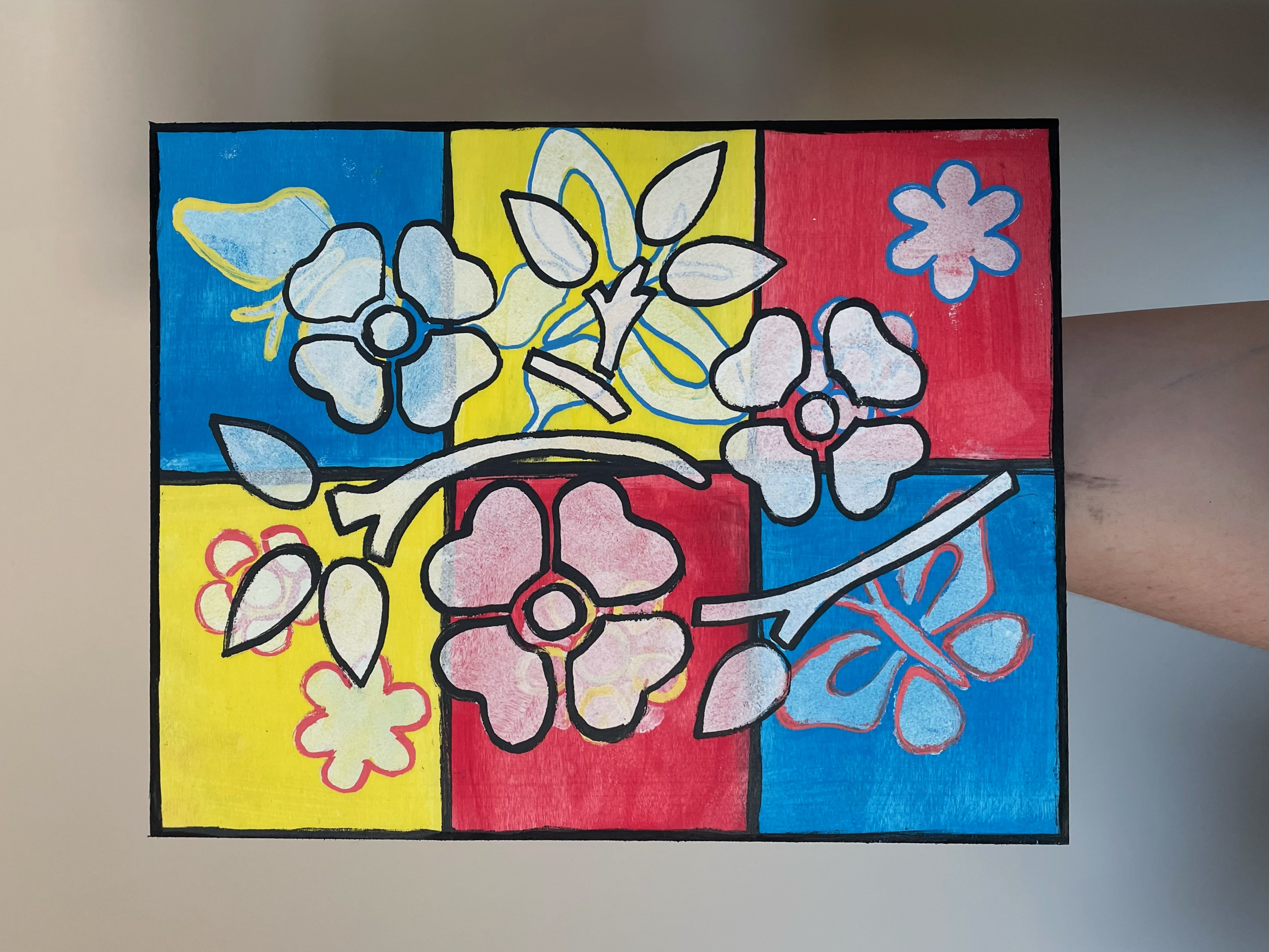 Painting for HSC Painting with blue, yellow, and red squares with white flowers overtop.