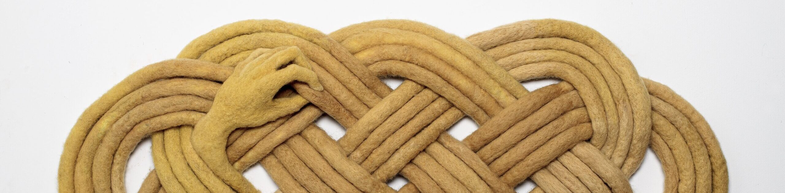 a knotted and felted flax coloured Textile artwork by Alana Morouney