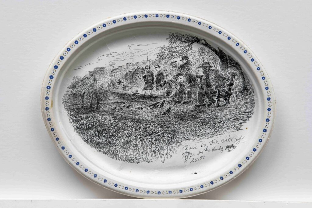 A pen and ink drawing by Harold Cromwell on a Chinet plate