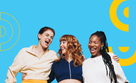 Three young women against a blue background with yellow graphics